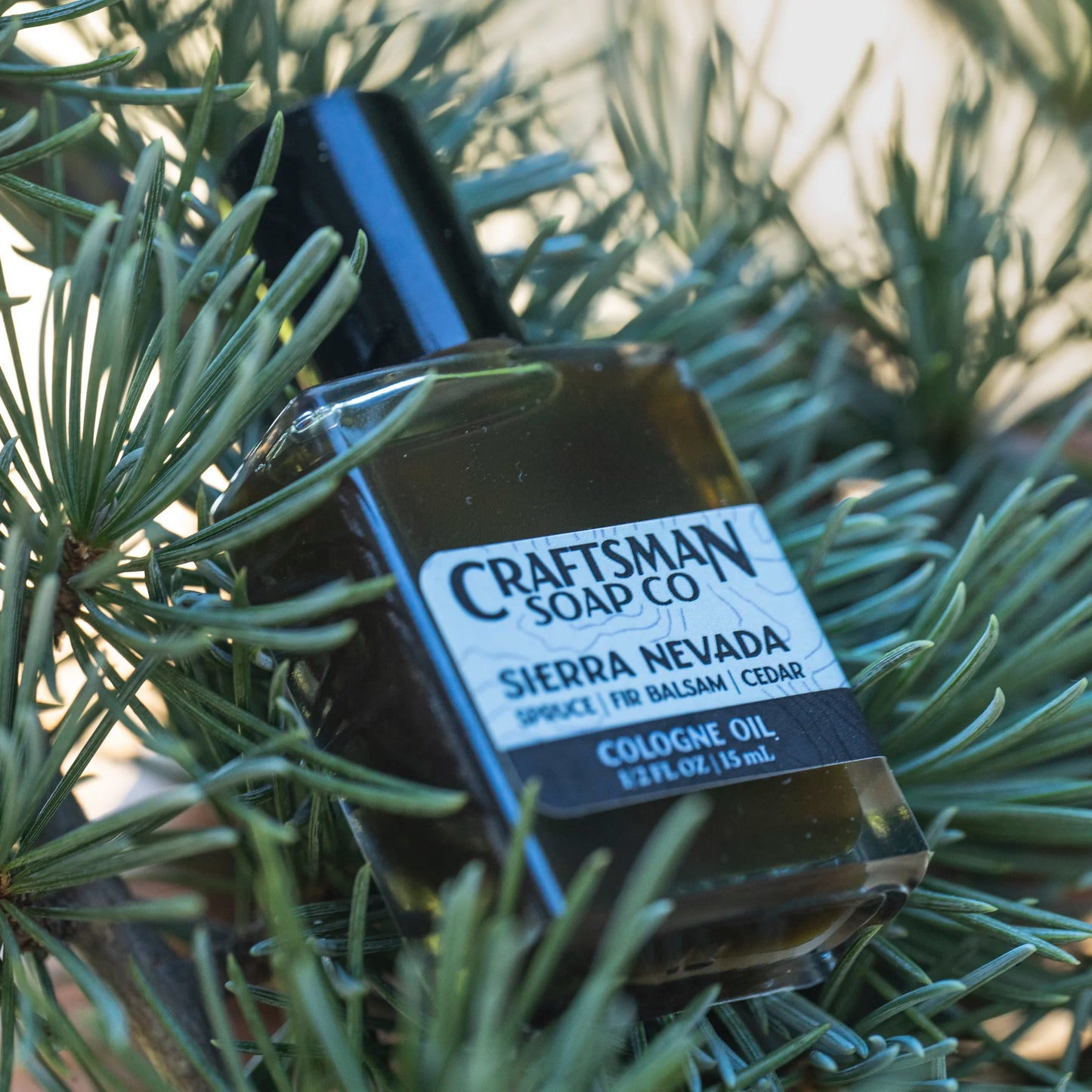 Craftsman Soap Co. Sierra Nevada Cologne Oil in clear glass roller ball bottle with black cap — spruce and fir essential oil cologne handcrafted in Los Angeles