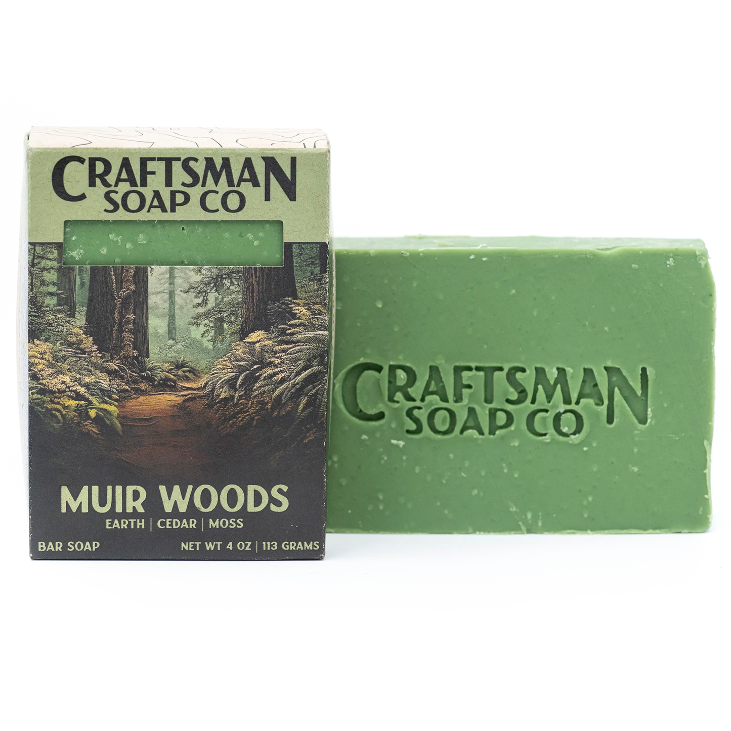 Muir Woods natural handmade soap bar by Craftsman Soap Co, forest green with brand stamp, beside redwood trail gift box, essential oils, cold process